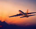 airplane flight sunset